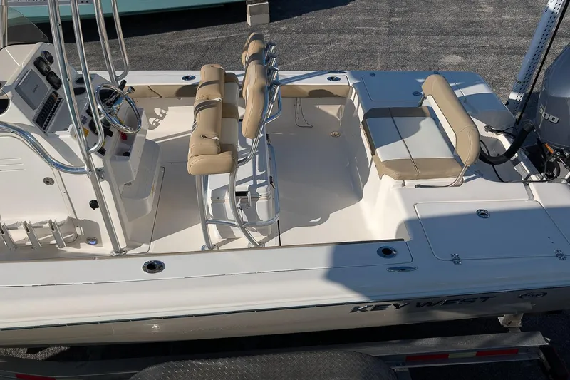 Slide: The Image of 2014 Key West 246 Bay Reef boat interior with seating and console. - 8