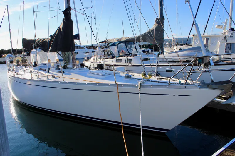 The Image of 1973 Nautor Swan 44 sailboat docked in a marina, side view. - 0