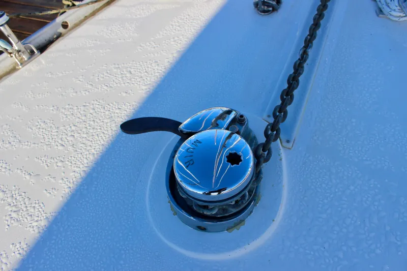 Slide: The Image of Chrome winch on 1973 Nautor Swan 44 yacht deck with chain. - 10