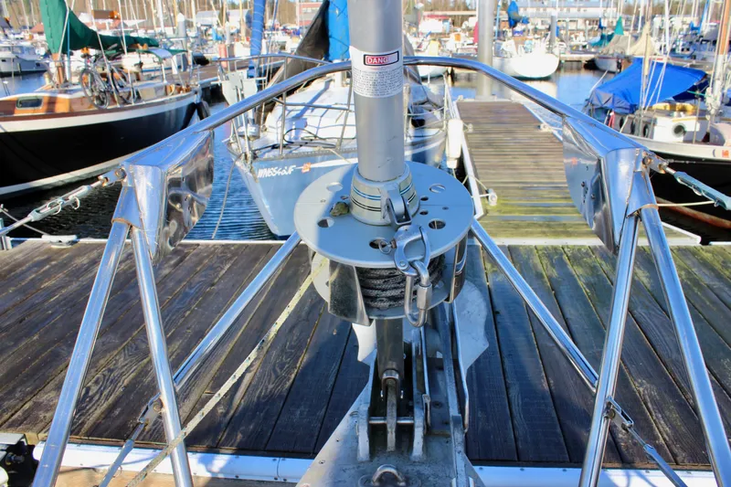 Slide: The Image of Bow view of a 1973 Nautor Swan 44 sailboat docked at a marina. - 11