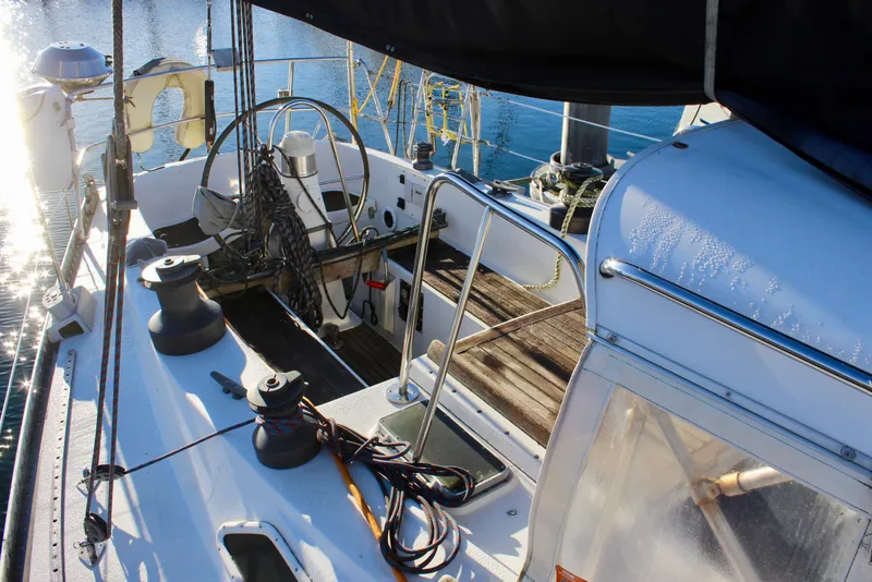 Slide: The Image of 1973 Nautor Swan 44 sailboat cockpit with steering wheel and winches. - 15