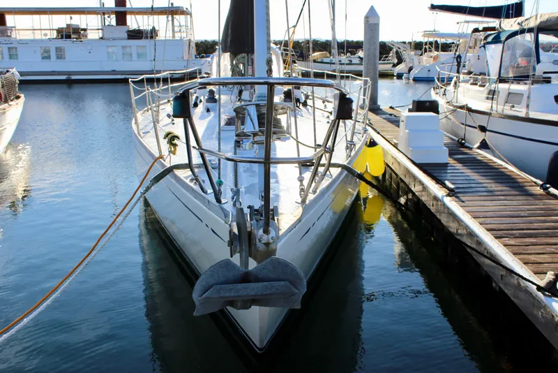 Slide: The Image of 1973 Nautor Swan 44 sailboat docked at marina, front view. - 2