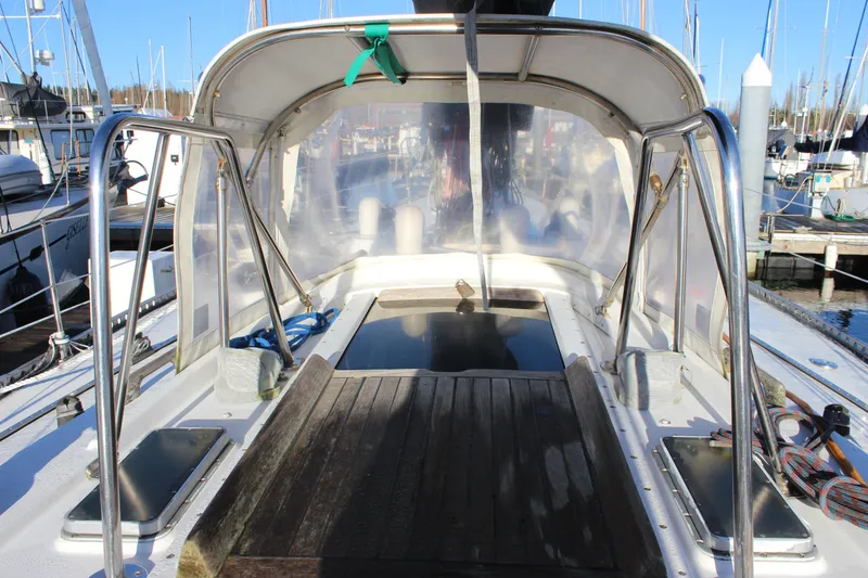 Slide: The Image of Cockpit of a 1973 Nautor Swan 44 sailboat, featuring a covered seating area. - 29