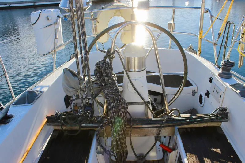 Slide: The Image of Cockpit of a 1973 Nautor Swan 44 sailboat with steering wheel and rigging. - 33