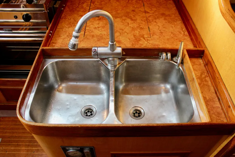 Slide: The Image of Stainless steel double sink in 1973 Nautor Swan 44 yacht galley. - 37