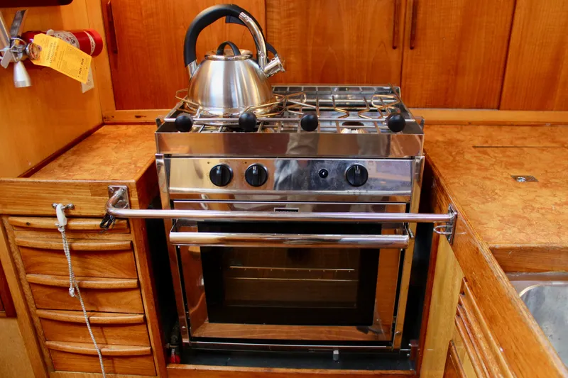 Slide: The Image of Stainless steel stove and kettle in 1973 Nautor Swan 44 yacht kitchen. - 38