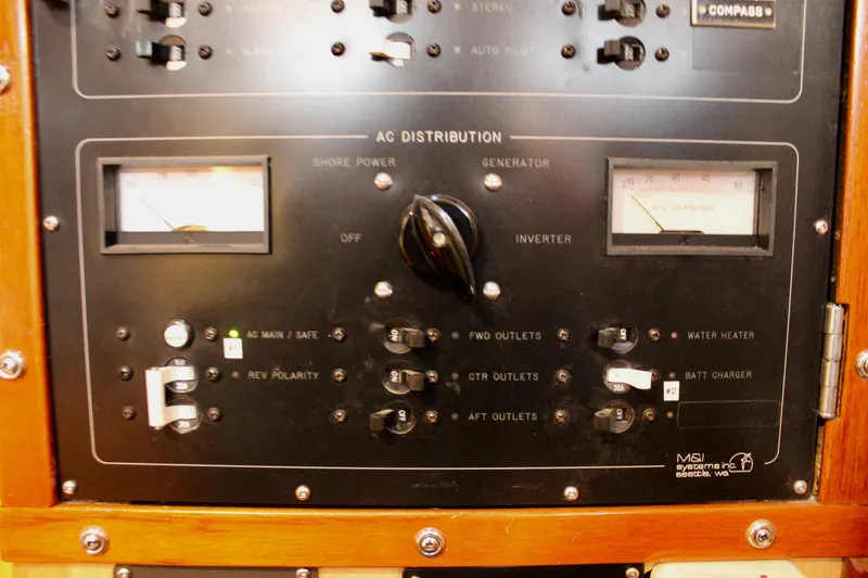 Slide: The Image of Electrical control panel on a 1973 Nautor Swan 44 yacht, featuring AC distribution switches. - 44