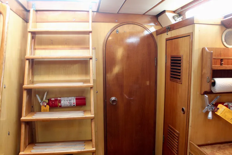 Slide: The Image of Interior of 1973 Nautor Swan 44 yacht with wooden stairs and cabinetry. - 50