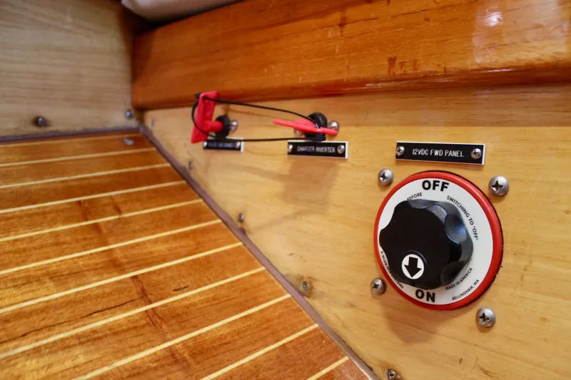 Slide: The Image of Control panel on 1973 Nautor Swan 44 yacht with wooden interior and switches. - 60