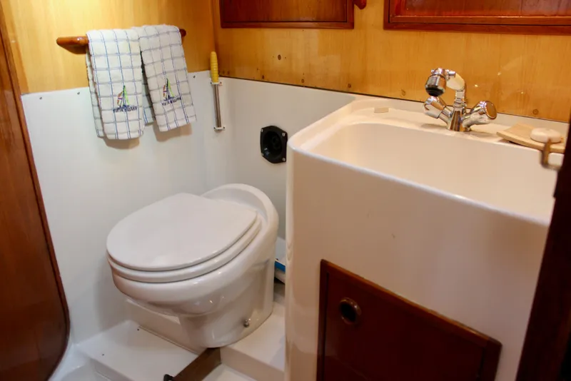 Slide: The Image of 1973 Nautor Swan 44 yacht bathroom with toilet and sink. - 63