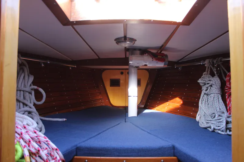 Slide: The Image of Interior cabin of 1973 Nautor Swan 44 sailboat with ropes and blue cushions. - 77
