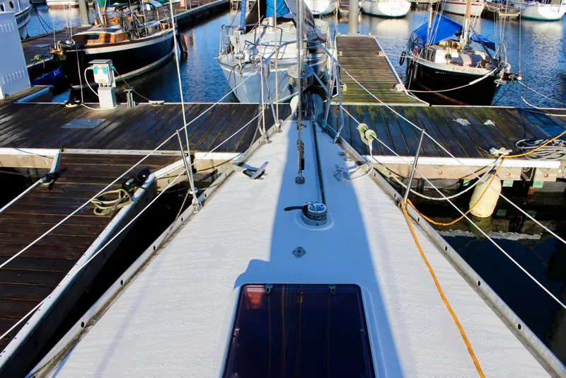 Slide: The Image of Nautor Swan 44 sailboat from 1973 docked at a marina, view from the deck. - 9