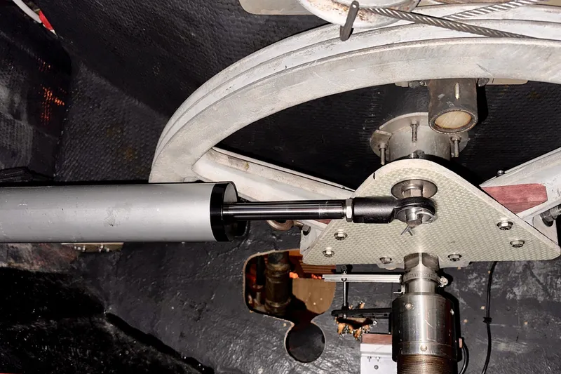 Slide: The Image of Steering mechanism of a 1973 Nautor Swan 44 yacht, featuring a hydraulic component. - 90