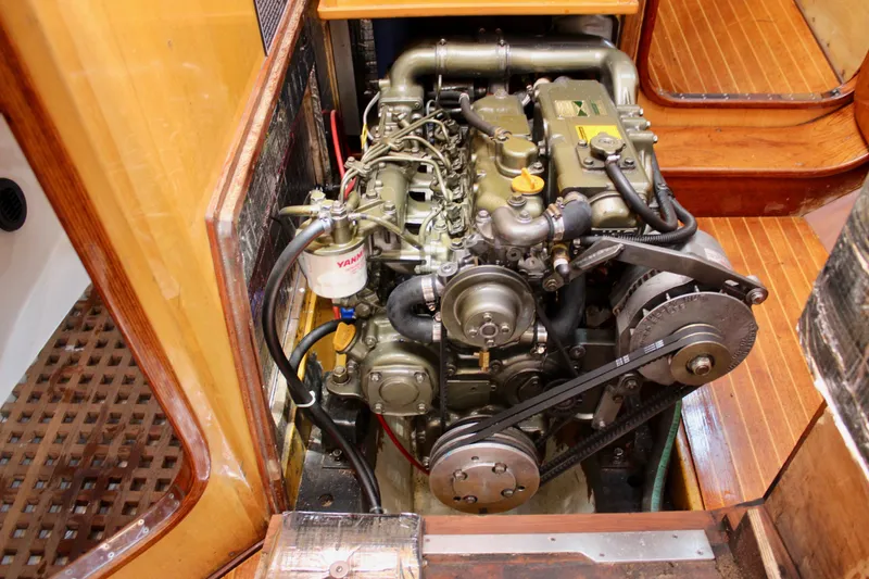 Slide: The Image of Engine compartment of a 1973 Nautor Swan 44 sailboat, featuring a Yanmar engine. - 92