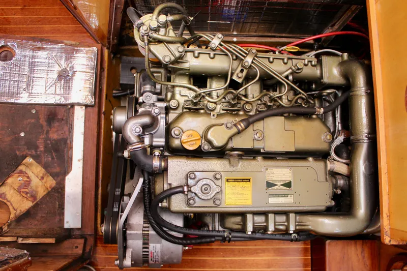 Slide: The Image of Engine of a 1973 Nautor Swan 44 sailboat, showcasing intricate mechanical details. - 94