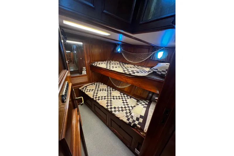 Slide: The Image of Cozy wooden cabin with bunk beds on a 1974 Doggersbank 63 yacht. - 11