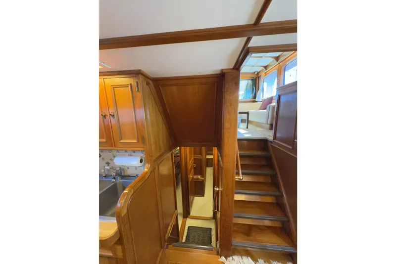 Slide: The Image of Interior of 1974 Doggersbank 63 yacht with wooden stairs and cabinetry. - 14
