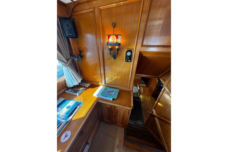 Slide: The Image of Interior of 1974 Doggersbank 63 yacht with wooden paneling and nautical decor. - 17