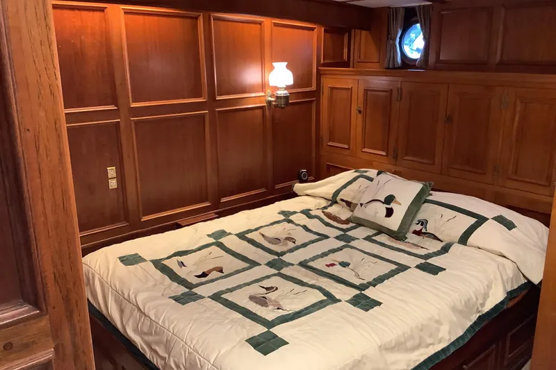 Slide: The Image of Cozy wooden cabin bedroom on 1974 Doggersbank 63 yacht with nautical decor. - 18