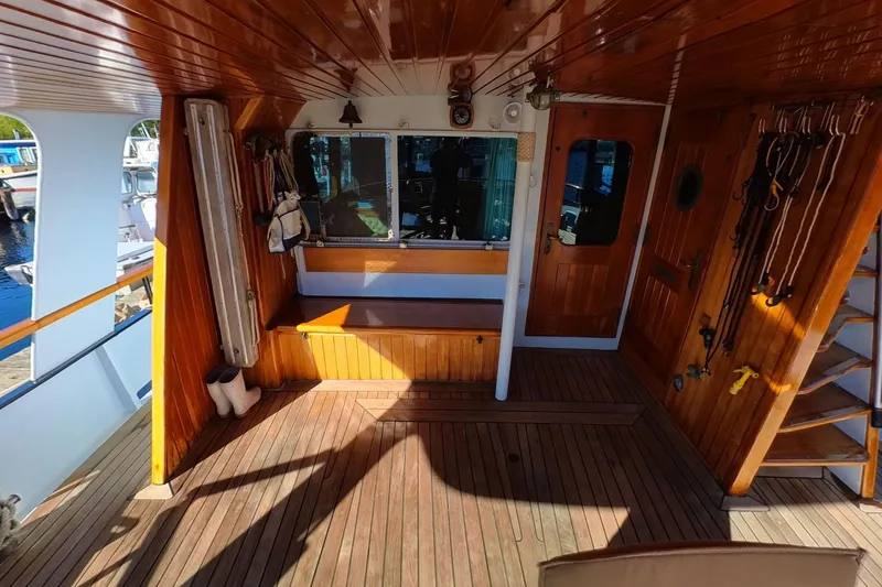 Slide: The Image of Wooden deck of 1974 Doggersbank 63 yacht with nautical equipment and seating. - 19