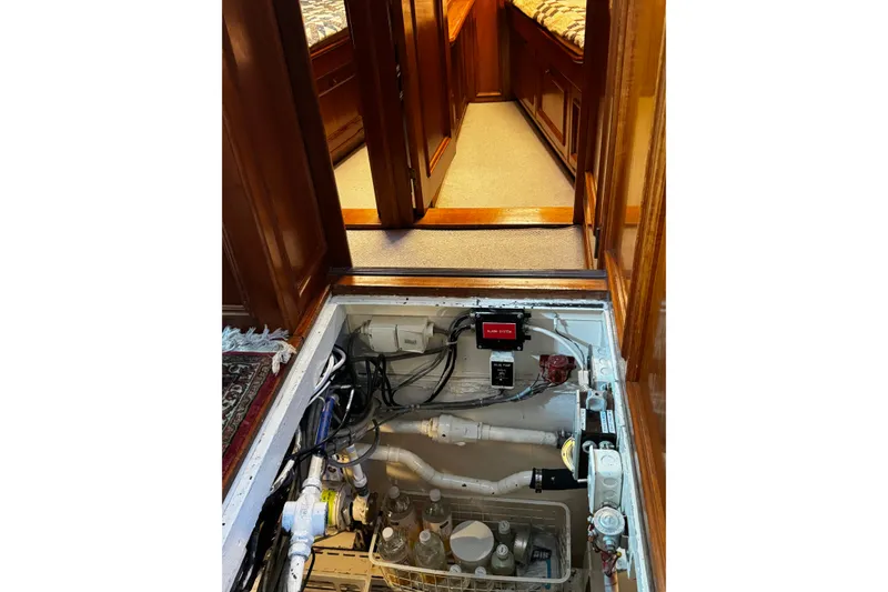 Slide: The Image of Engine compartment of a 1974 Doggersbank 63 yacht, showing mechanical systems and wiring. - 27