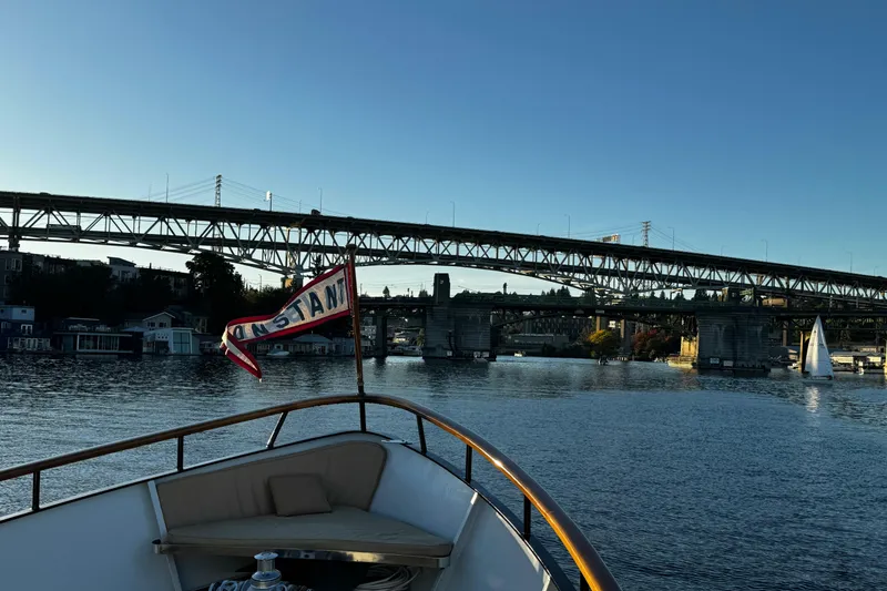 Slide: The Image of 1974 Doggersbank 63 yacht cruising under a bridge with a sailboat nearby. - 29