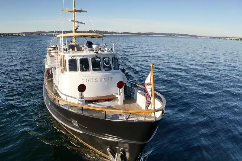 Slide: The Image of 1974 Doggersbank 63 yacht "Constant" cruising on calm blue waters. - 36