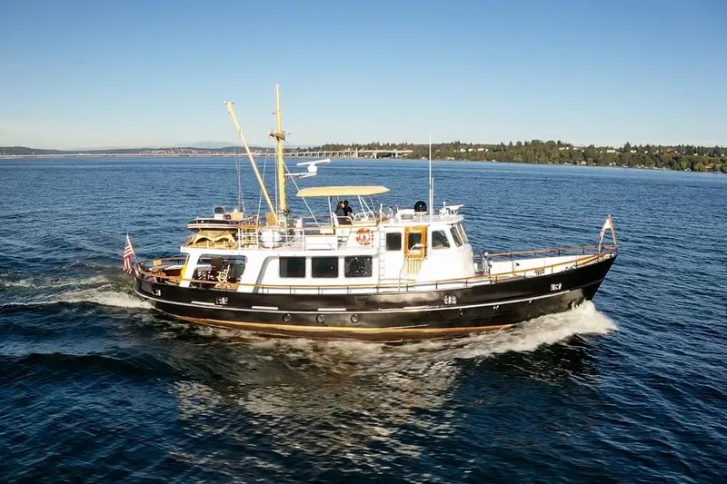 Slide: The Image of A 1974 Doggersbank 63 yacht cruising on a sunny day in open waters. - 37