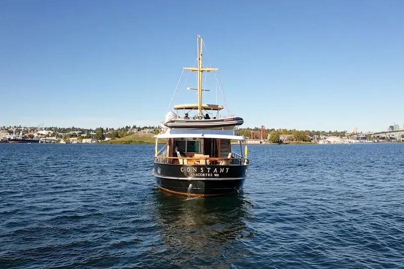 Slide: The Image of Vintage 1974 Doggersbank 63 yacht on calm water under clear blue sky. - 39