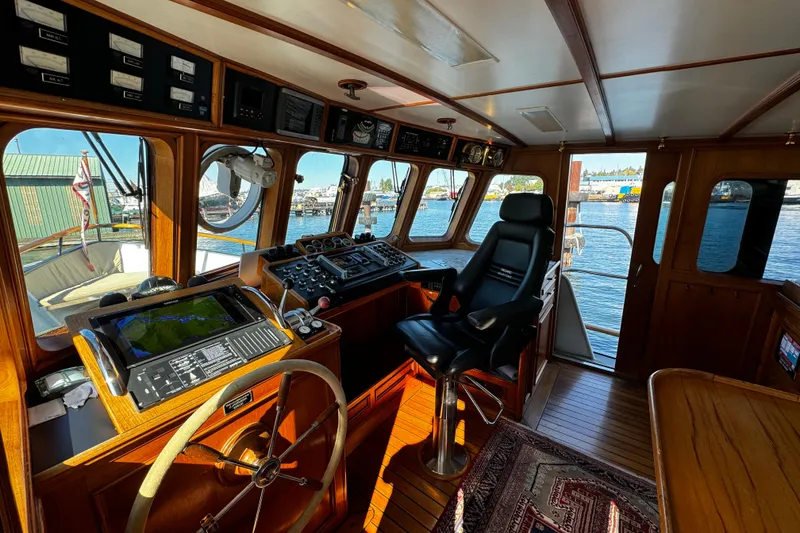 Slide: The Image of 1974 Doggersbank 63 yacht interior with navigation equipment and captain's chair. - 4