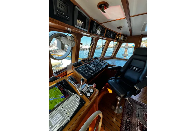 Slide: The Image of Vintage 1974 Doggersbank 63 yacht cockpit with navigation equipment and captain's chair. - 6