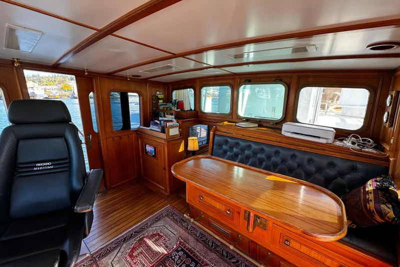 Slide: The Image of Luxurious 1974 Doggersbank 63 yacht interior with wood paneling and leather seating. - 7