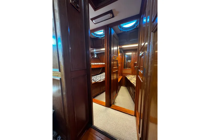 Slide: The Image of Interior of 1974 Doggersbank 63 yacht with wooden paneling and cozy cabin. - 8