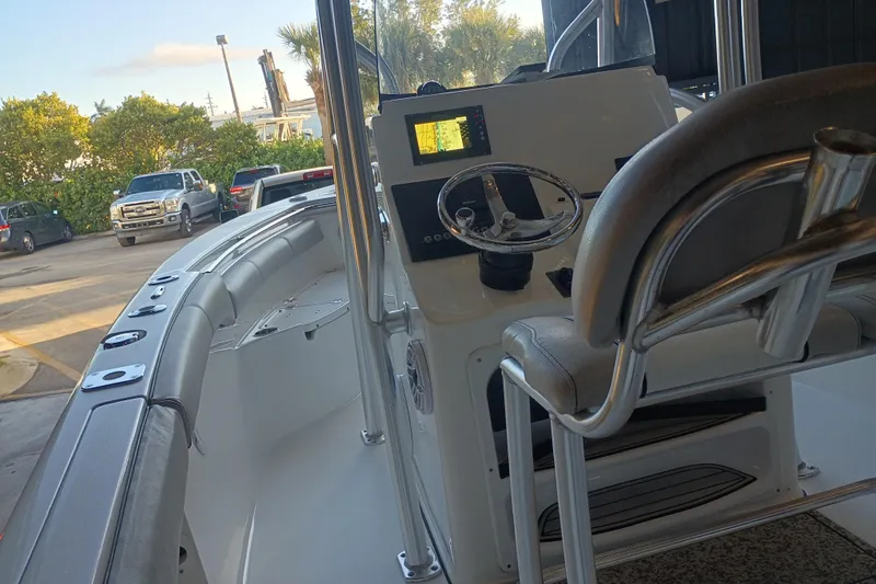 Slide: The Image of 2017 Seapro 219 boat interior with steering wheel and navigation display. - 10