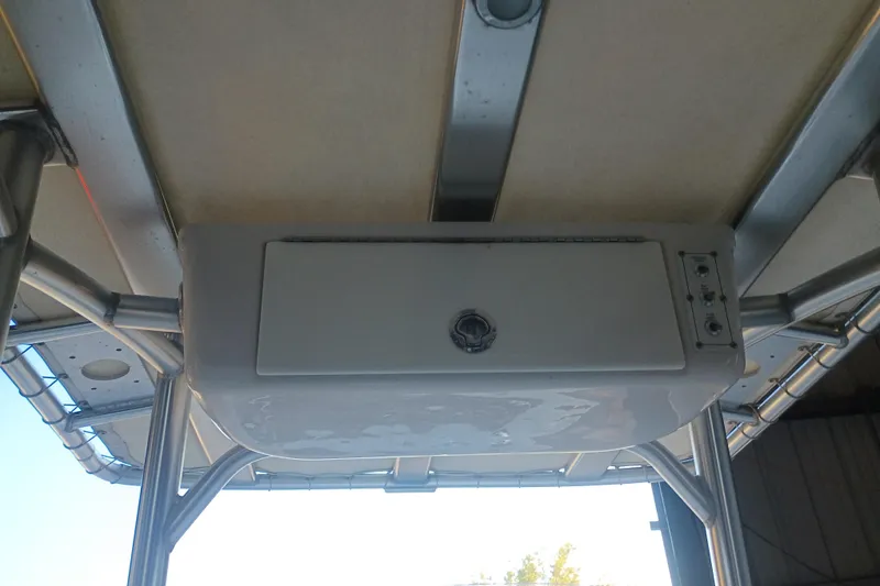 Slide: The Image of 2017 Seapro 219 boat T-top with storage compartment and metal framework. - 22