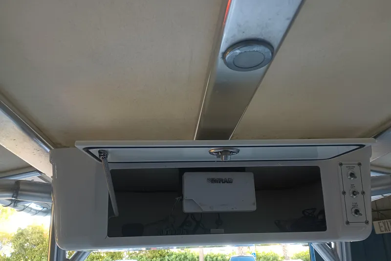 Slide: The Image of 2017 Seapro 219 boat console with electronics and storage compartment. - 23