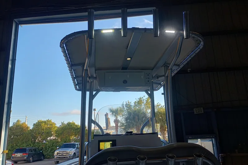 Slide: The Image of 2017 Seapro 219 boat with T-top in a garage, exterior view. - 24