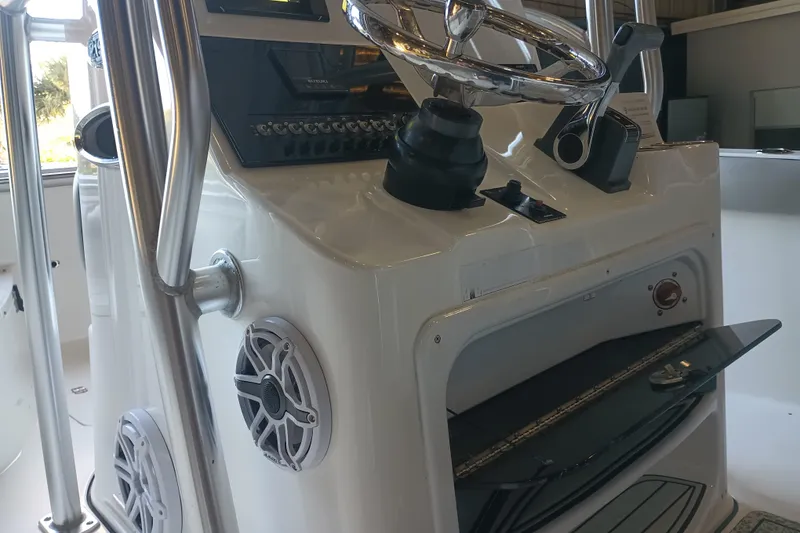 Slide: The Image of 2017 Seapro 219 boat console with steering wheel and controls. - 27