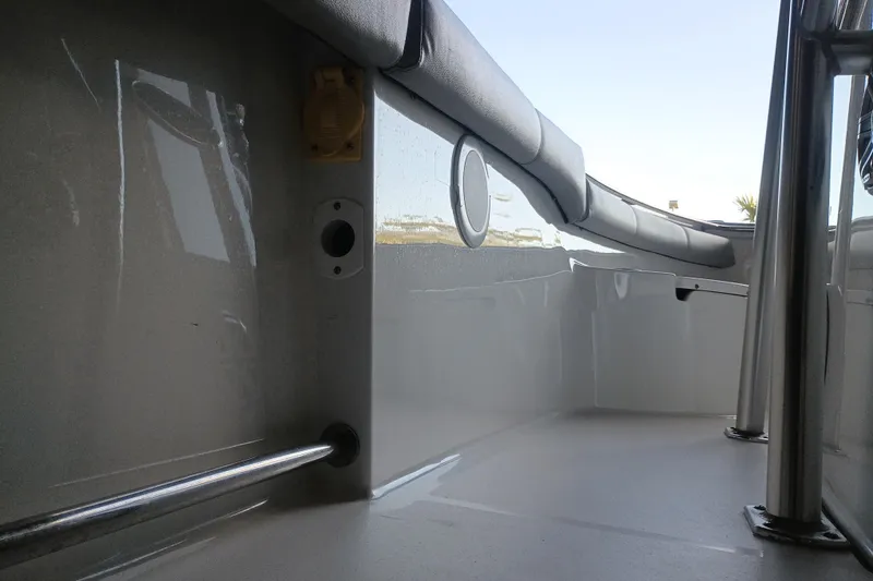Slide: The Image of Interior view of 2017 Seapro 219 boat, featuring sleek seating and stainless steel railings. - 28