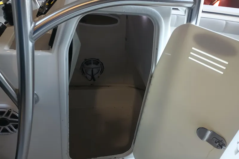 Slide: The Image of 2017 Seapro 219 boat storage compartment with open door and visible speaker. - 29