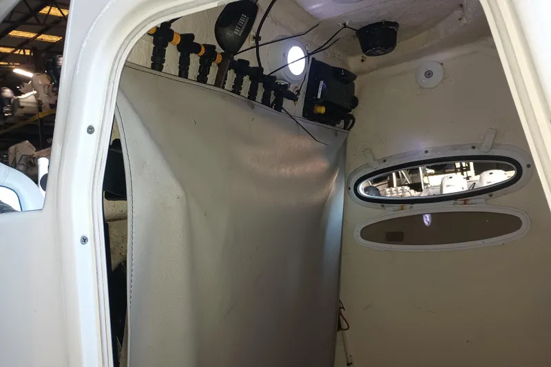 Slide: The Image of Interior view of a 2017 Seapro 219 boat cabin with equipment and portholes. - 32