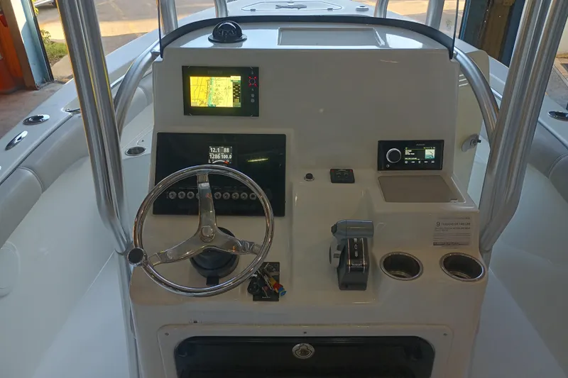 Slide: The Image of 2017 Seapro 219 boat dashboard with steering wheel and navigation displays. - 6