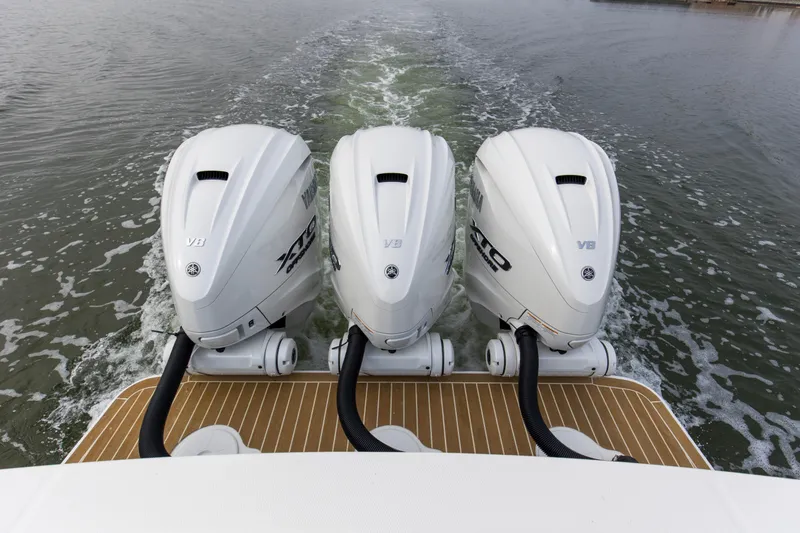 Slide: The Image of Triple Yamaha V8 outboard engines on 2024 Regulator 37 boat, cruising on water. - 12