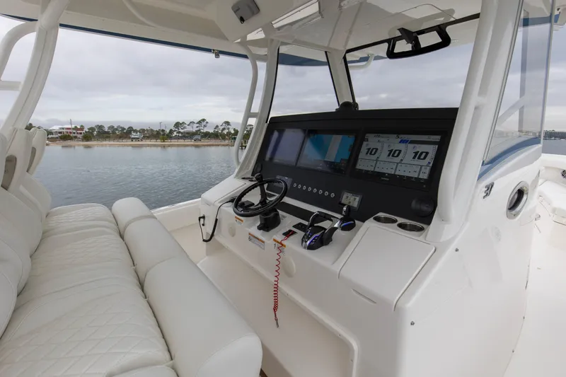 Slide: The Image of 2024 Regulator 37 boat cockpit with modern navigation system and luxurious seating. - 20