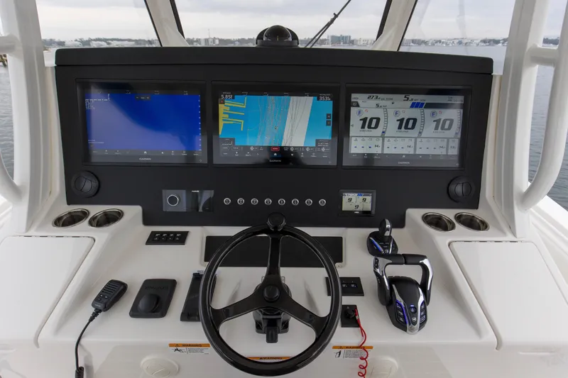 Slide: The Image of 2024 Regulator 37 helm with advanced navigation displays and controls. - 22