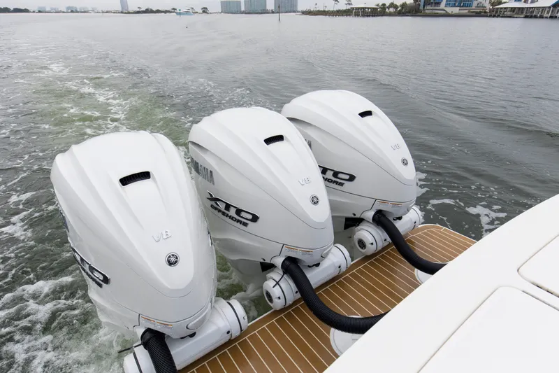 Slide: The Image of Triple Yamaha XTO V8 engines on 2024 Regulator 37 boat, cruising on water. - 25