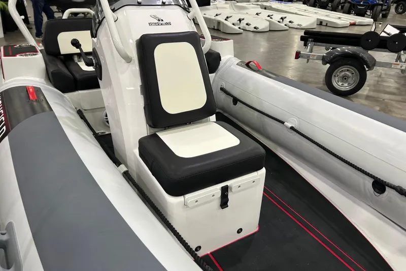 Slide: The Image of 2026 Highfield Velox 420 inflatable boat interior with seating and control console. - 10