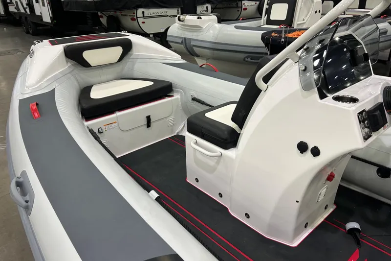 Slide: The Image of 2026 Highfield Velox 420 inflatable boat with sleek seating and modern console design. - 5