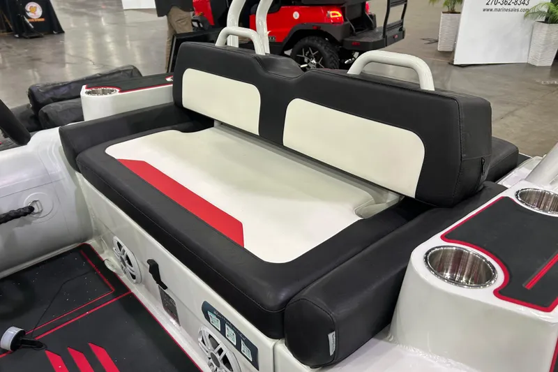 Slide: The Image of 2026 Highfield Velox 420 boat interior with black and white seating and cup holders. - 6