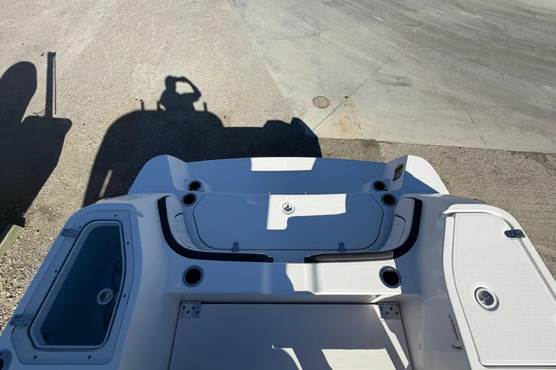 Slide: The Image of 2022 Yamaha Boats 252 FSH Sport, rear deck view with storage compartments. - 31